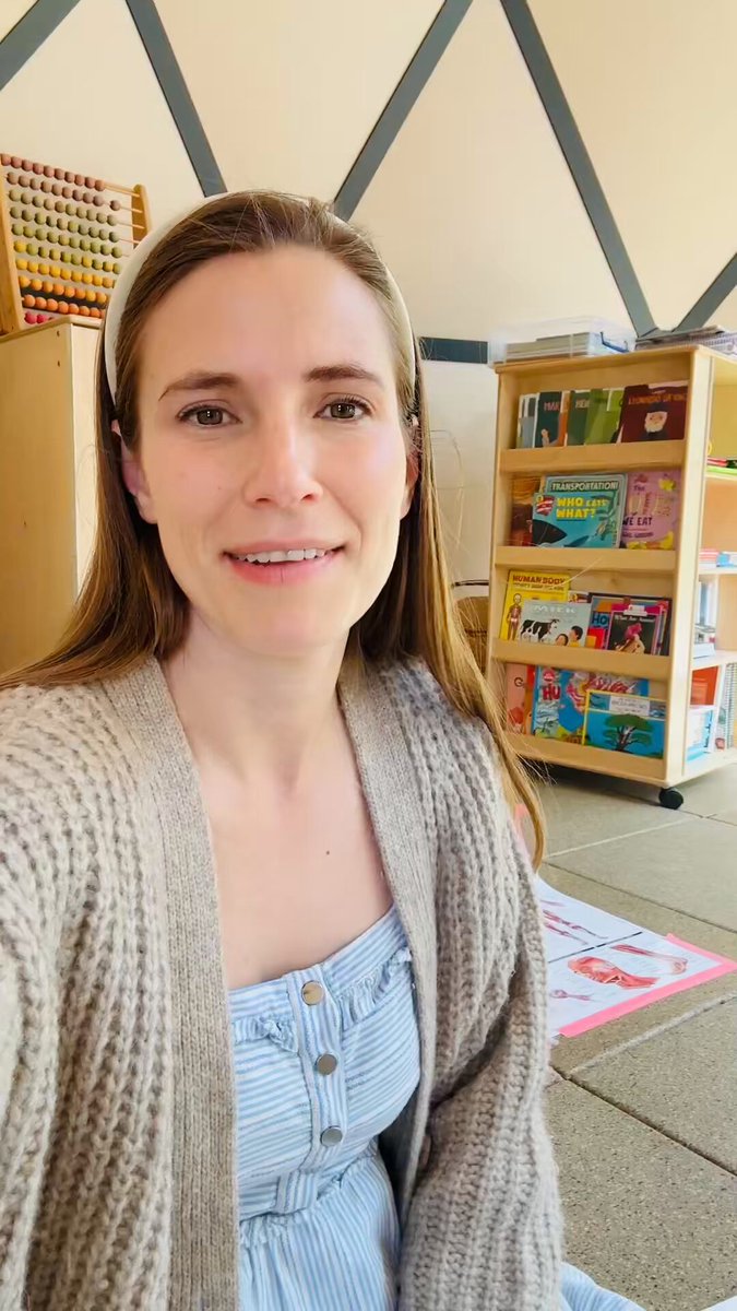 E-ink display hanging in a bedroom showing phonics learning content for kids
